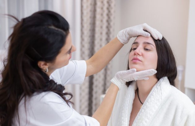 Woman receiving professional Acne Scar Treatment in Dubai for smoother and clearer skin at a modern aesthetic clinic.